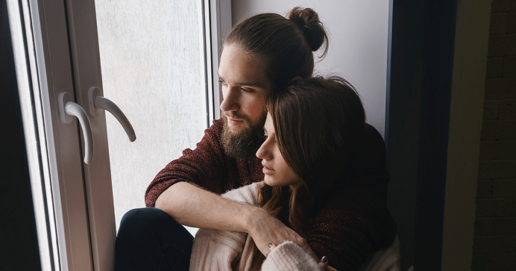 Couple discussing support and options during an unexpected pregnancy